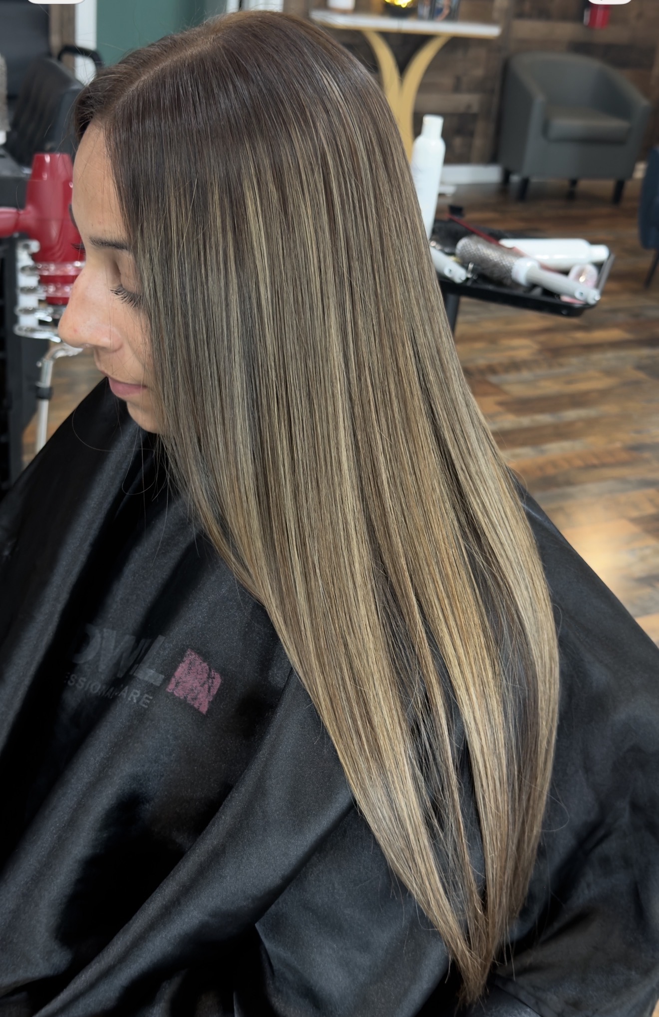 Straight brown hair with soft blonde highlights